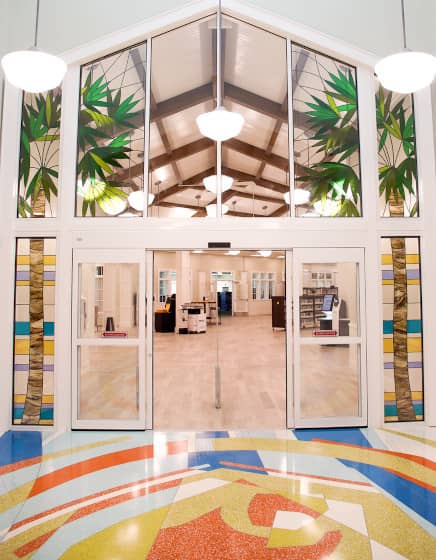 Lobby entrance to Riverview Public Library with stained glass and terrazzo floor mural