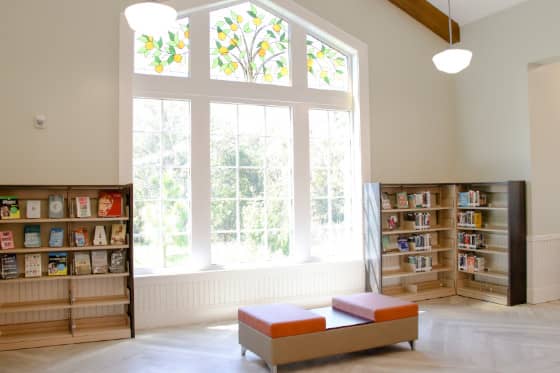 Bench in front of large sunlit window